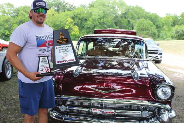Brice Dornak of Aquilla rode home with the People’s Choice award along with a Top 10 award for his 1957 Bel Air at Saturday’s car show in Clifton City Park. Ashley Barner | The Clifton Record